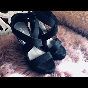 Black criss cross platforms